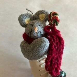 FREE WITH PURCHASE Mouse ornament with scarf and lollipop tucked in an ice skate